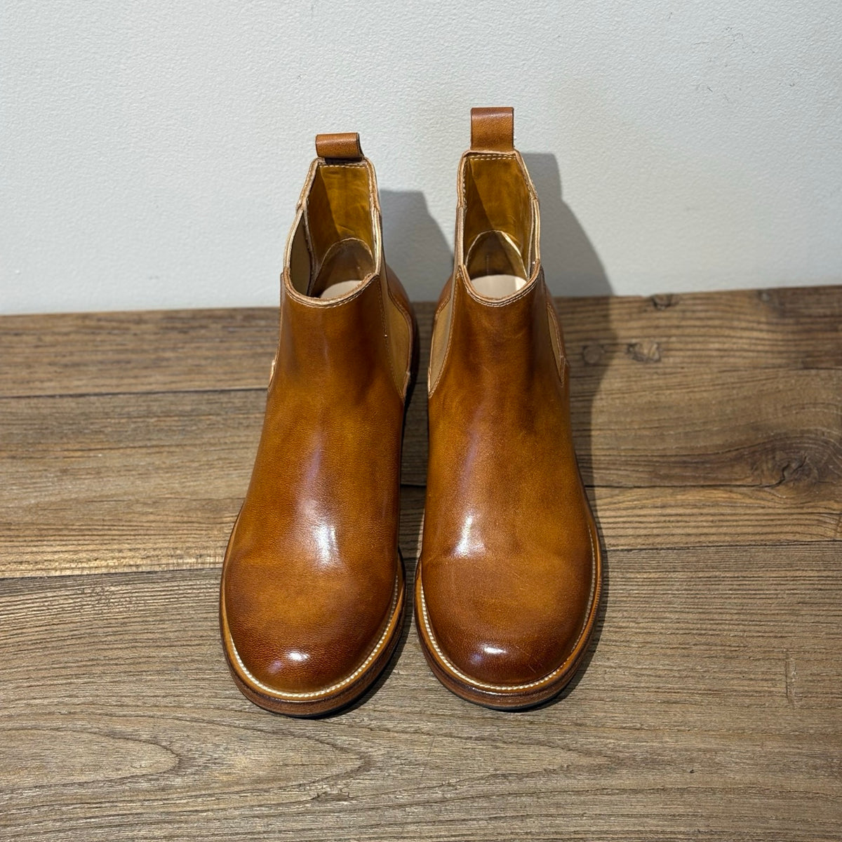 Detailed view of leather Chelsea boot toe welt stitching
